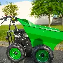 Mini dumper motorisé vert à quatre roues, benne en position horizontale et manettes de contrôles, stationné en extérieur sur un sol sur la route avec fond d'arbres