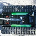 Vue de dessus du châssis et des chenilles d’un dumper Chargeur Plus, avec vérin hydraulique et amortisseurs à ressorts visibles