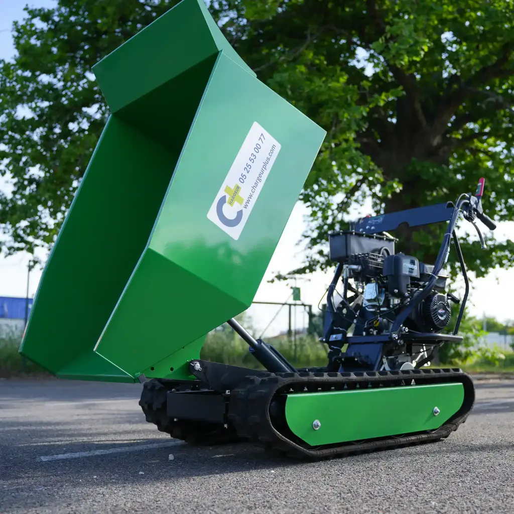 Dumper à chenilles Chargeur Plus avec benne hydraulique verte en position de déversement