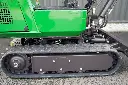 Chargeurplus: Gros plan sur le train de chenilles en caoutchouc renforcé, conçu pour offrir une excellente stabilité, une traction optimale et une grande maniabilité sur différents types de surfaces.