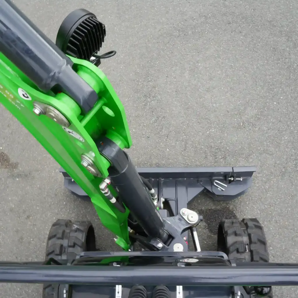 photo vue de haut du déport de flèche, de côté et chenilles de faces pour montrer utilité déport de flèche.